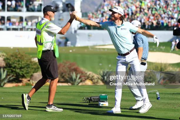 Sam Ryder of the United States reacts to his hole-in-one on the 16th hole during the third round of the WM Phoenix Open at TPC Scottsdale on February...