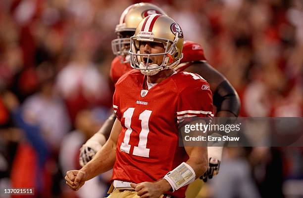 Alex Smith of the San Francisco 49ers celebrates after running in for a touchdown in the fourth quarter of the NFC Divisional playoff game against...