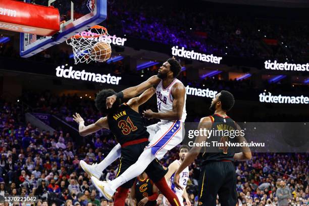 Joel Embiid of the Philadelphia 76ers dunks over Jarrett Allen of the Cleveland Cavaliers during the second quarter at Wells Fargo Center on February...