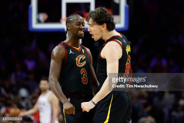 Caris LeVert and Cedi Osman of the Cleveland Cavaliers celebrate during the second quarter against the Philadelphia 76ers at Wells Fargo Center on...