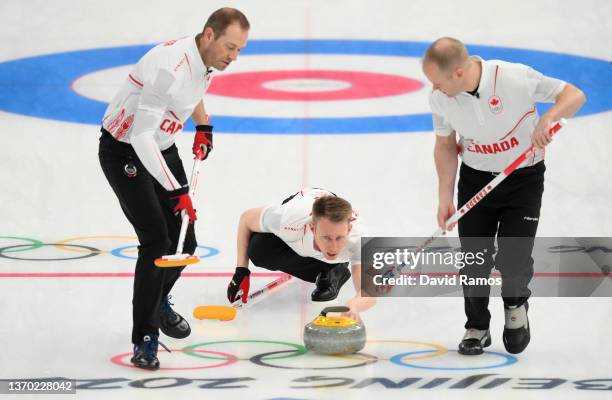 Geoff Walker, Marc Kennedy and Mark Nichols of Team Canada compete during the Men's Curling Round Robin Session against Team United States on Day 9...