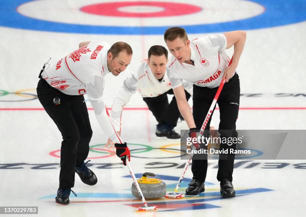 Geoff Walker, Brad Gushue and Marc Kennedy of Team Canada compete during the Men's Curling Round Robin Session against Team United States on Day 9 of...