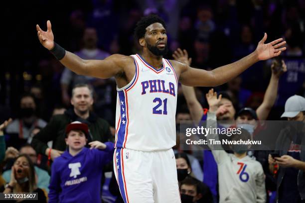 Joel Embiid of the Philadelphia 76ers reacts during the fourth quarter against the Cleveland Cavaliers at Wells Fargo Center on February 12, 2022 in...