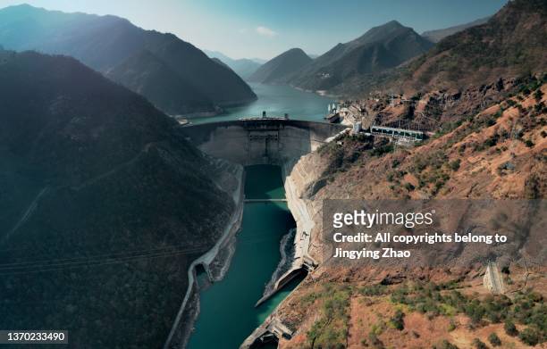 aerial photo of huge hydropower station dam in southwest china - hydroelectric power stock pictures, royalty-free photos & images