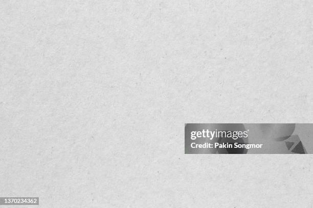 white colored eco-recycled kraft paper sheet texture was used to create the background. - fibre stock pictures, royalty-free photos & images