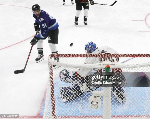 Shot by Nazem Kadri of the Colorado Avalanche bounces off the crossbar as Jack Campbell of the Toronto Maple Leafs defends the net during the game...