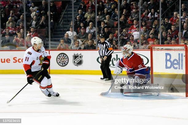 Daniel Alfredsson of the Ottawa Senators scores the game winning goal during the shootout against Carey Price of the Montreal Canadiens during the...