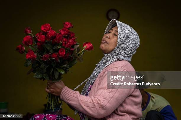 Vendor prepares roses ahead of Valentine's Day on February 13, 2022 in Malang, Indonesia. Indonesia will celebrate Valentine's day as COVID-19...