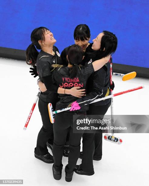 Chinami Yoshida, Yurika Yoshida, Yumi Suzuki and Satsuki Fujisawa of Team Japan celebrate their victory in the Curling Women's Round Robin game...