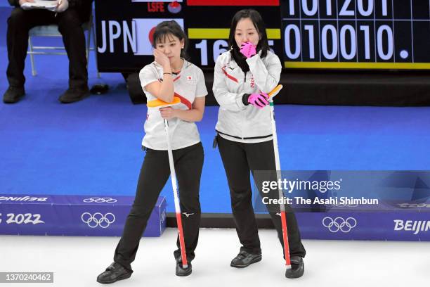 Chinami Yoshida and Satsuki Fujisawa of Team Japan discuss at the 7th end during the Curling Women's Round Robin game against Team ROC on Day Eight...