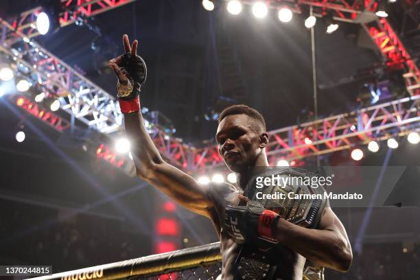 Israel Adesanya of Nigeria celebrates after defending his middleweight championship against Robert Whittaker of Australia during UFC 271 at Toyota...