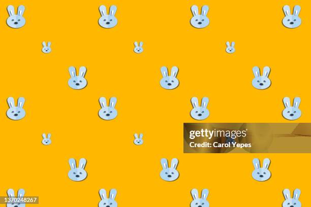 easter rabbit seamless pattern in yellow - pets icon blue stock pictures, royalty-free photos & images