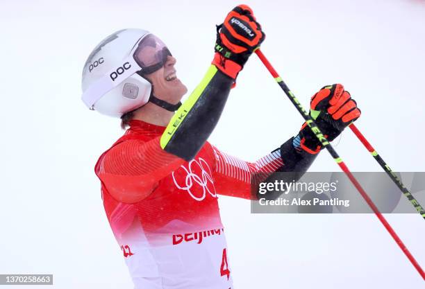 Marco Odermatt of Team Switzerland reacts following his run skis during the Men's Giant Slalom Run 2 on day nine of the Beijing 2022 Winter Olympic...