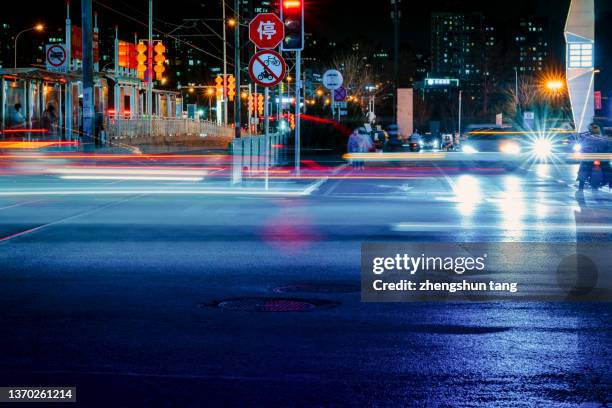 car lights at night. - road signal stock pictures, royalty-free photos & images