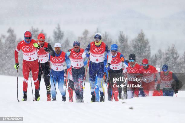 Alexey Chervotkin of Team ROC and Oskar Svensson of Team Sweden compete during the Men's Cross-Country Skiing 4x10km Relay on Day 9 of the Beijing...