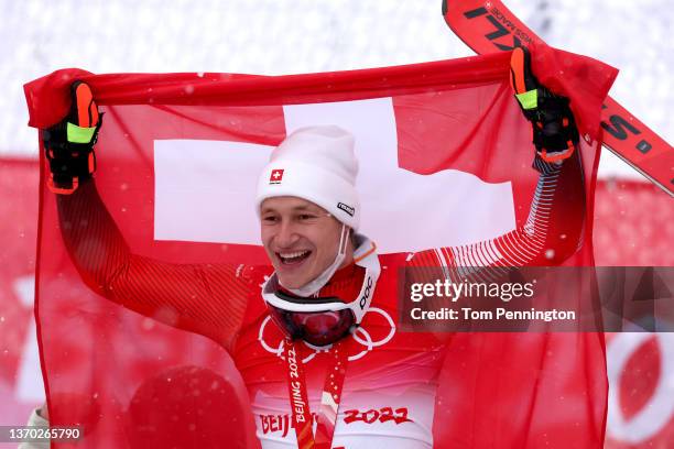 Gold medalist Marco Odermatt of Team Switzerland celebrates during the Men's Giant Slalom medal ceremony on day nine of the Beijing 2022 Winter...