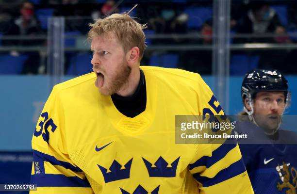 Goalkeeper Magnus Hellberg of Team Sweden reacts after forward Miro Aaltonen of Team Finland is pushed into him during the Men's Ice Hockey...