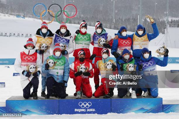 Gold medallists Alexey Chervotkin, Alexander Bolshunov, Denis Spitsov and Sergey Ustiugov of Team ROC , Silver medallists Emil Iversen, Paal Golberg,...