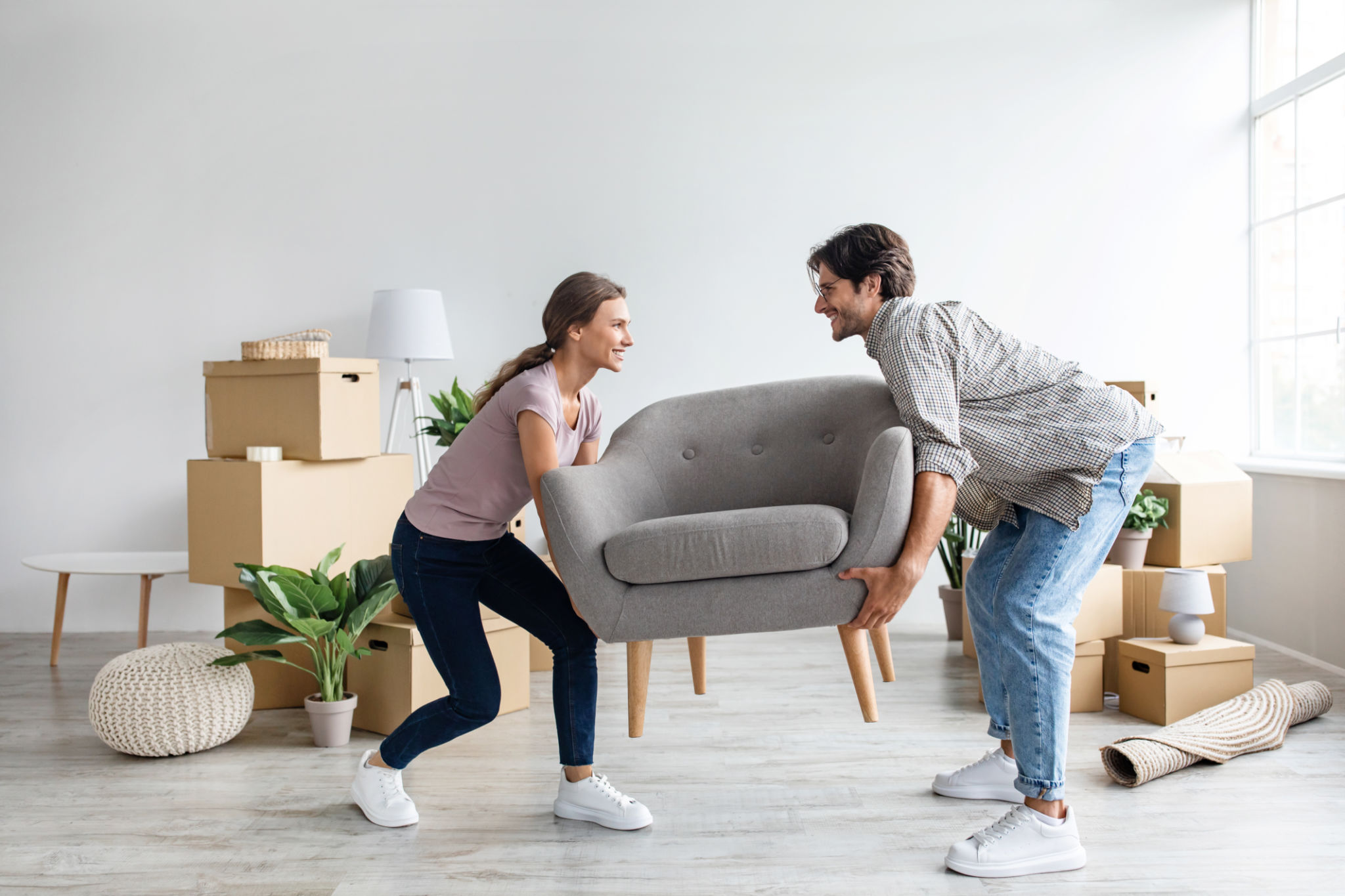 people lifting furniture