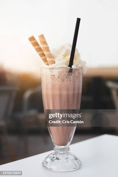 chocolate milkshake with cream - chocolate milkshake stock pictures, royalty-free photos & images