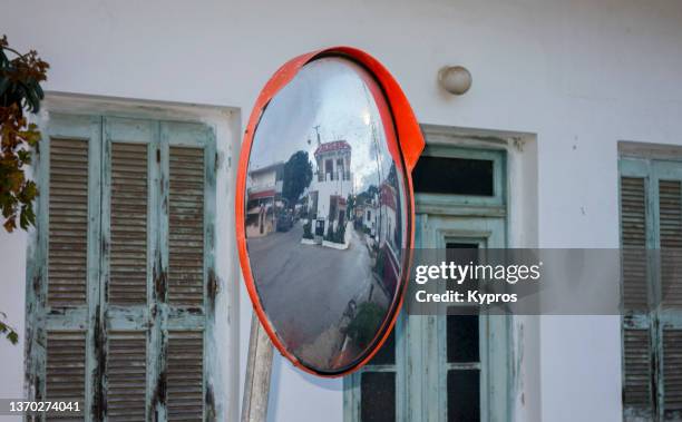 round mirror at junction of roads intended to help prevent accidents - greece - convex stock pictures, royalty-free photos & images