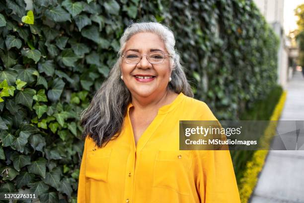 portrait of beautiful senior woman - hispanic woman 60s stock pictures, royalty-free photos & images
