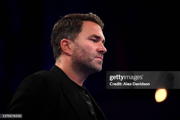 Eddie Hearn looks on after the super-middleweight fight between Daniel Jacobs and John Ryder at Alexandra Palace on February 12, 2022 in London,...