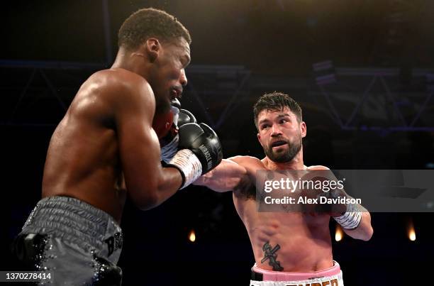 John Ryder punches Daniel Jacobs during the super-middleweight fight between Daniel Jacobs and John Ryder at Alexandra Palace on February 12, 2022 in...