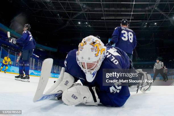 Goalkeeper Jussi Olkinuora of Team Finland reacts in his goal area during the Men's Ice Hockey Preliminary Round Group C match between Team Finland...