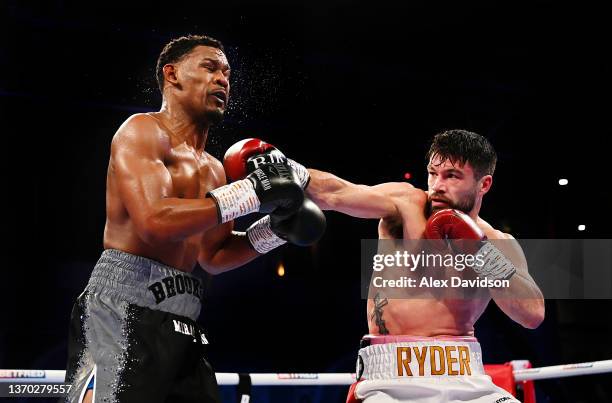 John Ryder punches Daniel Jacobs during the super-middleweight fight between Daniel Jacobs and John Ryder at Alexandra Palace on February 12, 2022 in...