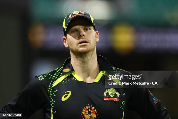 Steve Smith of Australia reacts as he leaves the field of play after hitting his head after taking a catch over the boundary rope during game two in...