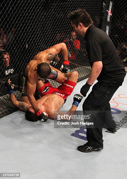 Jose Aldo punches Chad Mendes on the ground in a featherweight bout during UFC 142 at HSBC Arena on January 14, 2012 in Rio de Janeiro, Brazil.