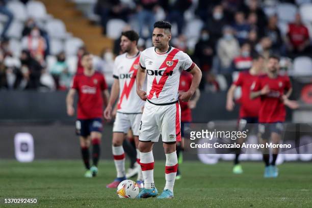 Radamel Falcao of Rayo Vallecano de Madrid reacts as Ca OSasuna players celebrate scoring theior opening goal during the LaLiga Santander match...