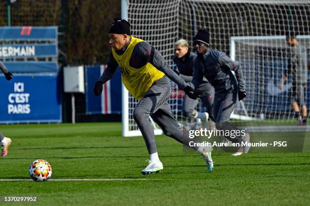 Kylian Mbappe runs with the ball during a Paris Saint-Germain training session at Ooredoo Center on February 13, 2022 in Paris, France.