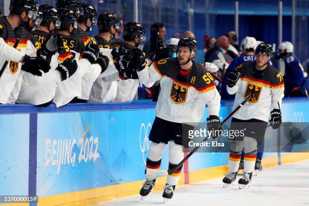 Patrick Hager of Team Germany celebrates a goal in the first period during the Men's Ice Hockey Preliminary Round Group A match between Team United...