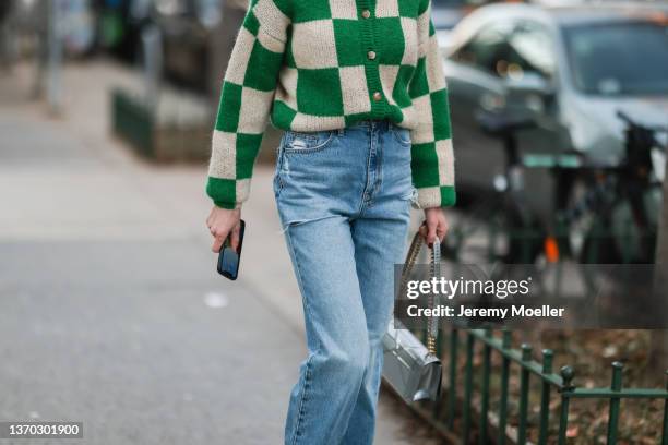 Fashion Week Guest is seen wearing a cardigan, blue jeans and a silver bag is seen outside Proenza Schouler during New York City Fashion Week on...