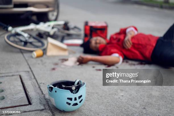 bicycle delivery man accidental - graphic accident photos stock pictures, royalty-free photos & images