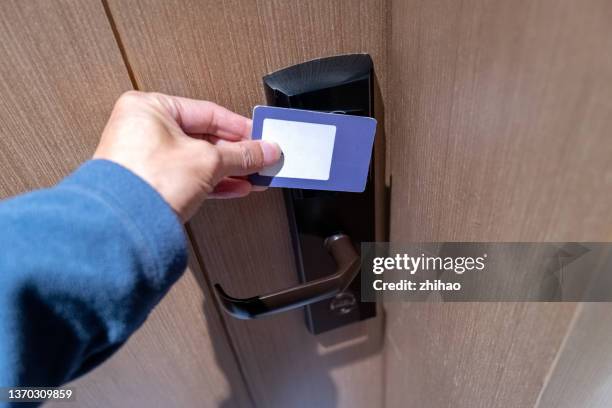 use the smart key card to open the door - keycard access bildbanksfoton och bilder