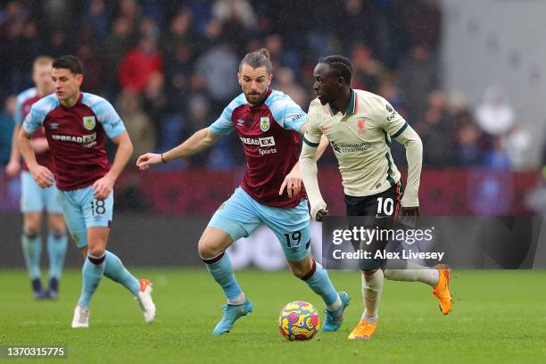 Sadio Mane of Liverpool is closed down by Jay Rodriguez of Burnley during the Premier League match between Burnley and Liverpool at Turf Moor on...