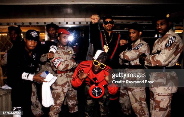Rappers Chuck D. , Professor Griff, Flavor Flav and DJ Terminator X of Public Enemy poses for photos backstage with The S1W's after their performance...