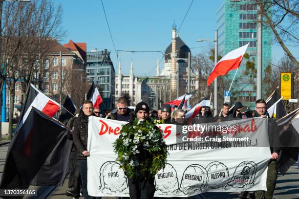 People take part in the Dresden Memorial March held by the Far-Right under the title of 'Action Alliance against Forgetting' on February 13, 2022 in...