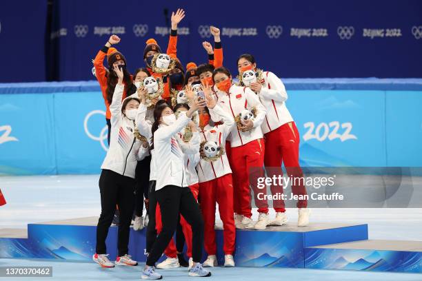 Gold medallists Team Netherlands, Silver Medallists Team South Korea and Bronze Medallists Team China celebrate during the Women's 3000m Short Track...