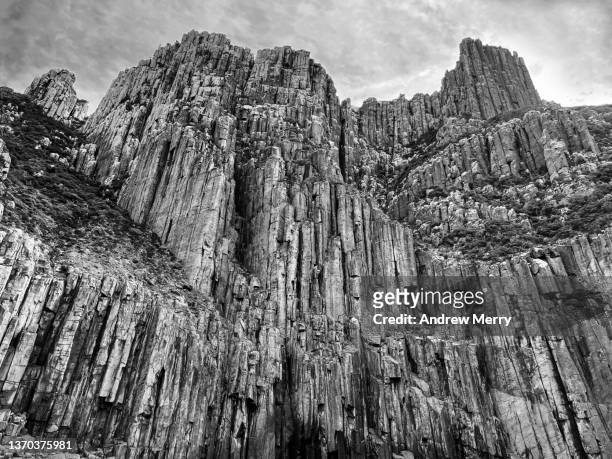 high cliffs, mountain rock face, black and white - cliff texture stock pictures, royalty-free photos & images