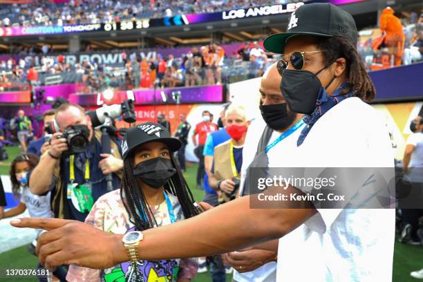 Rapper Jay-Z talks with his daughter Blue Ivy Carter before Super Bowl LVI between the Cincinnati Bengals and the Los Angeles Rams at SoFi Stadium on...