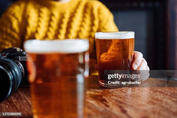 two glasses of ale beer on a table - london pub stock pictures, royalty-free photos & images