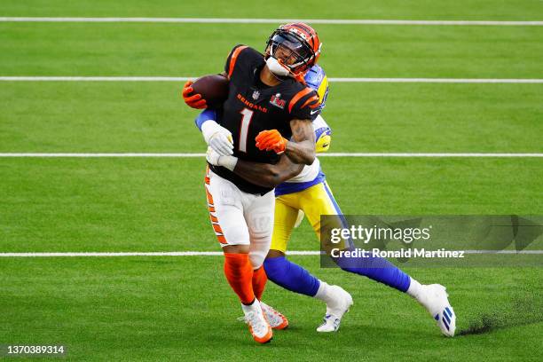 Ja'Marr Chase of the Cincinnati Bengals makes a catch over Jalen Ramsey of the Los Angeles Rams during Super Bowl LVI at SoFi Stadium on February 13,...