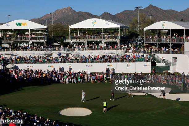 Scottie Scheffler of the United States reacts after a birdie on the third playoff hole to win the WM Phoenix Open at TPC Scottsdale on February 13,...