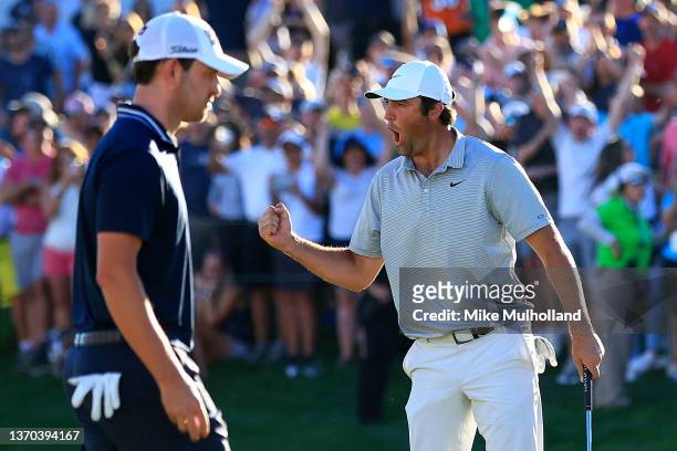 Scottie Scheffler of the United States reacts after a birdie on the third playoff hole against Patrick Cantlay of the United States to win the WM...