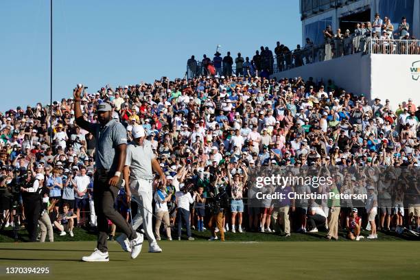 Sahith Theegala of the United States waves to the crowd on the 18th hole following the final round of the WM Phoenix Open at TPC Scottsdale on...