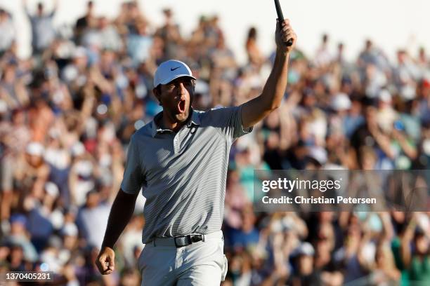 Scottie Scheffler of the United States celebrates after winning the the WM Phoenix Open in the final round at TPC Scottsdale on February 13, 2022 in...